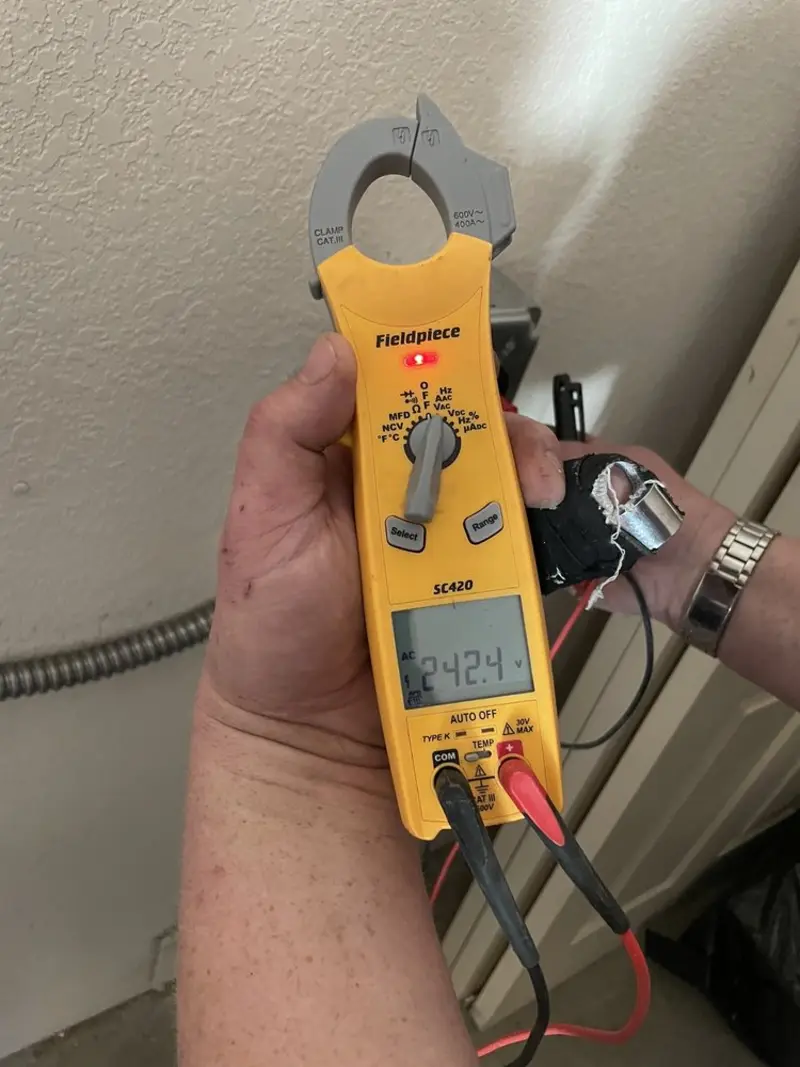 Voltage testing with clamp meter during Electrical Installation Services in Baxley